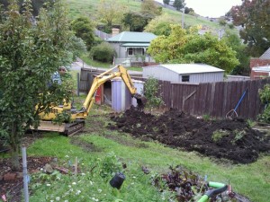 Tim and the Digger making mountains of dirt